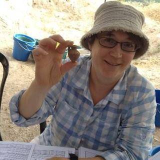 Elizabeth Arnold holding cermaics